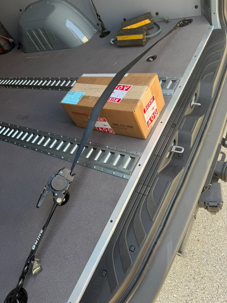 AOG rush parcel strapped to the floor