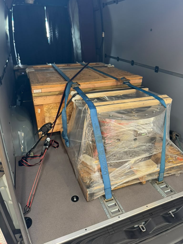 Wooden crate and wrapped machinery