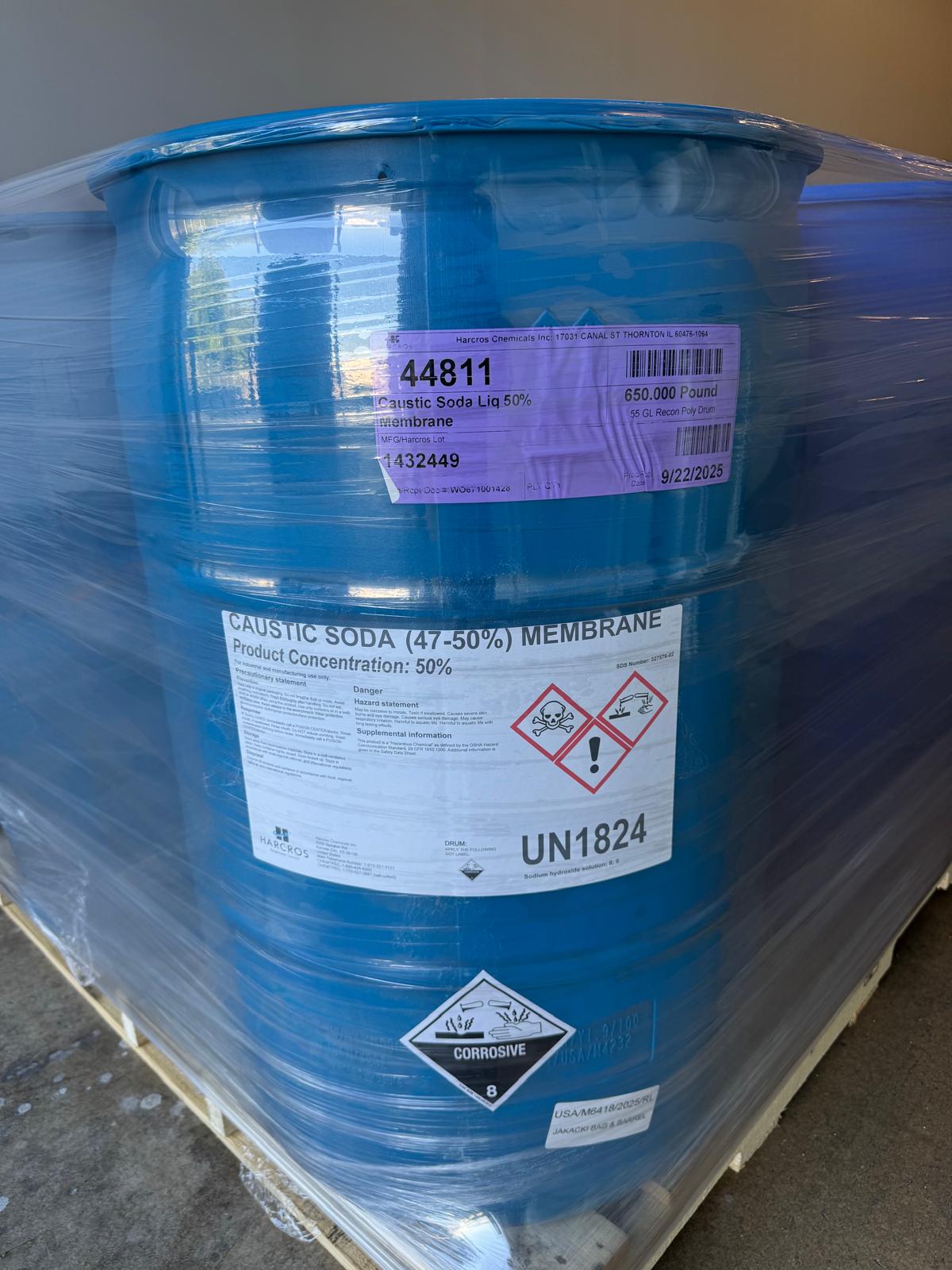 Placarded corrosive drum on a wrapped pallet